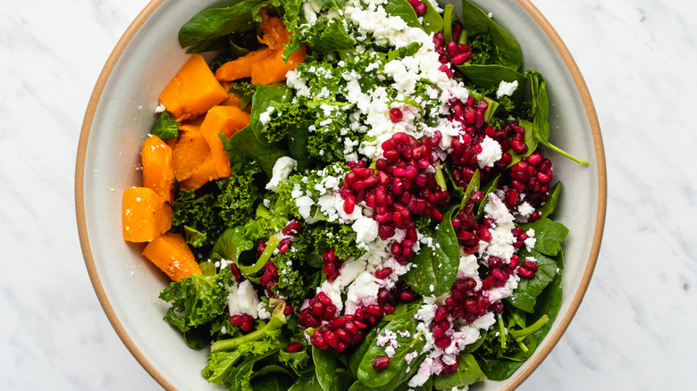 squash pomegranate salad in bowl 