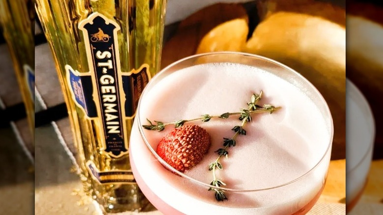 St. Germain cocktail with berries and herbs