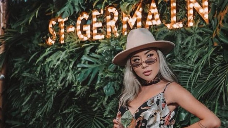 Woman standing by St. Germain sign