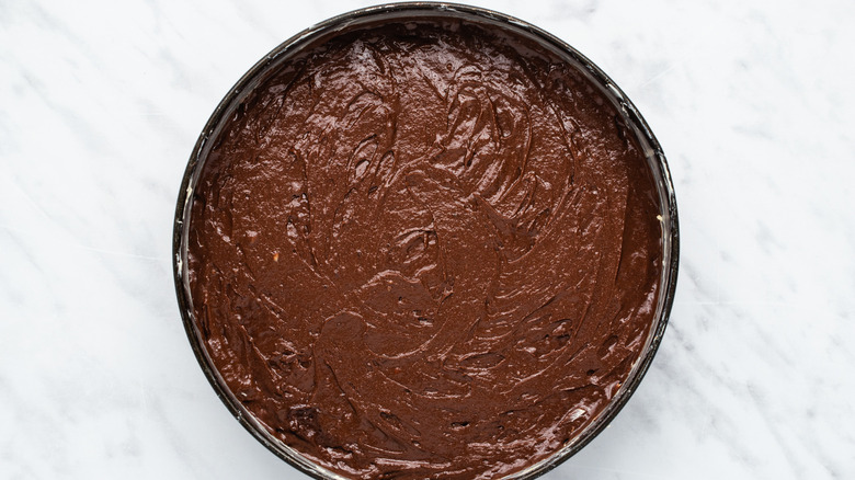 chocolate cake batter in pan 