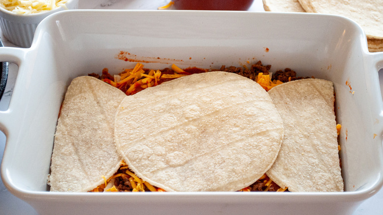 Tortillas stacked in enchilada casserole