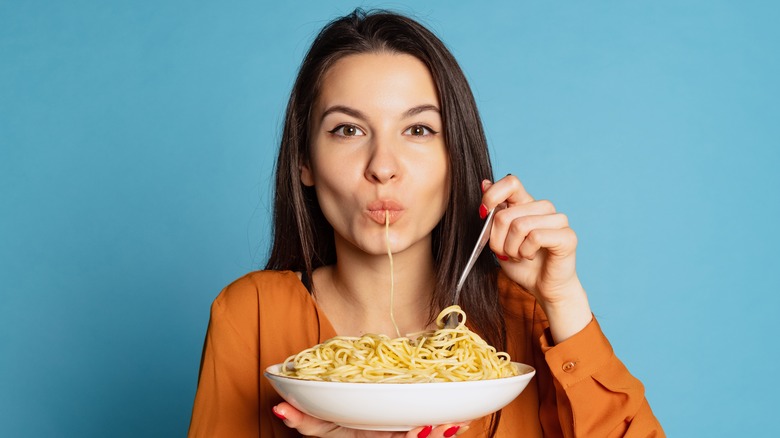 Woman eating spaghetti