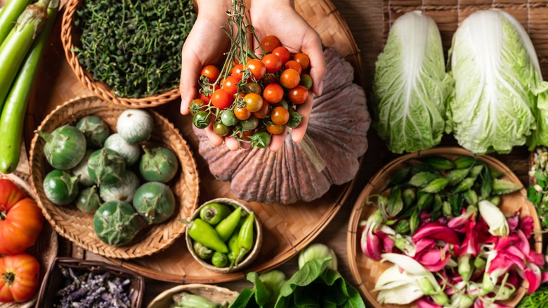 Hands holding fresh summer produce