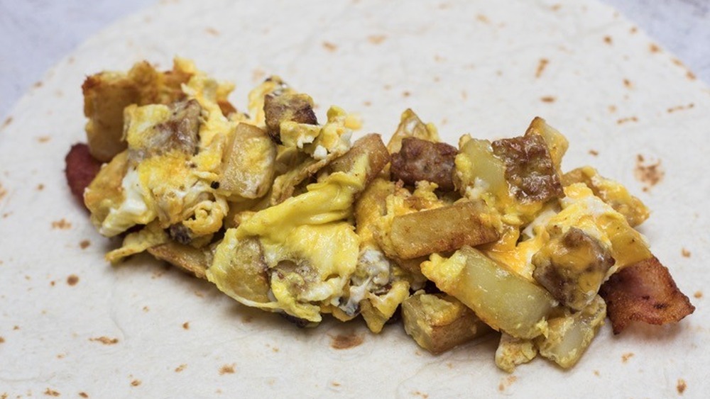 Starbucks Bacon, Sausage & Egg Wrap copycat recipe being prepared