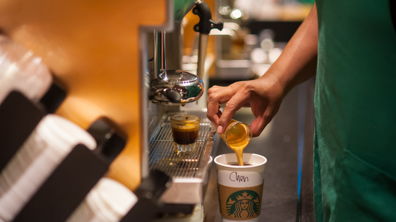 Starbucks barista making drink