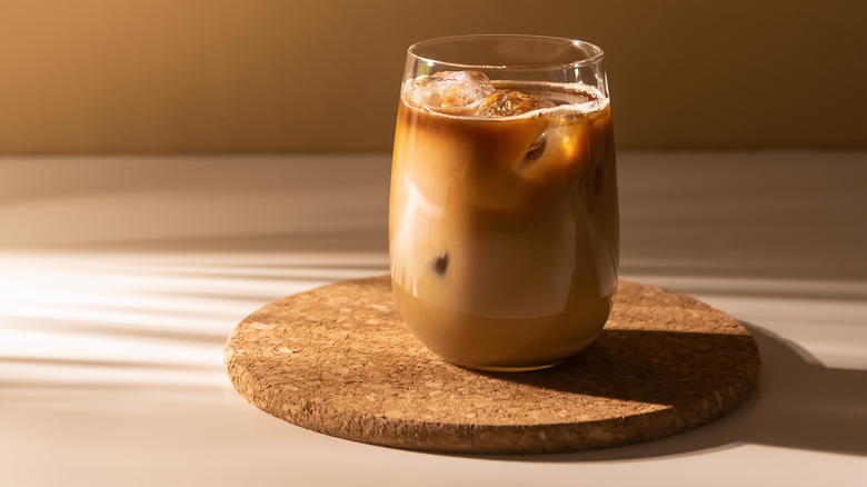 Glass of iced coffee on a trivet