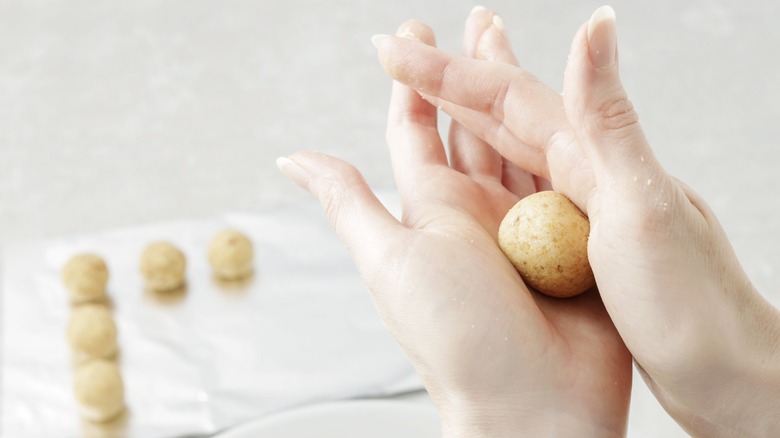 Woman rolling cake pops