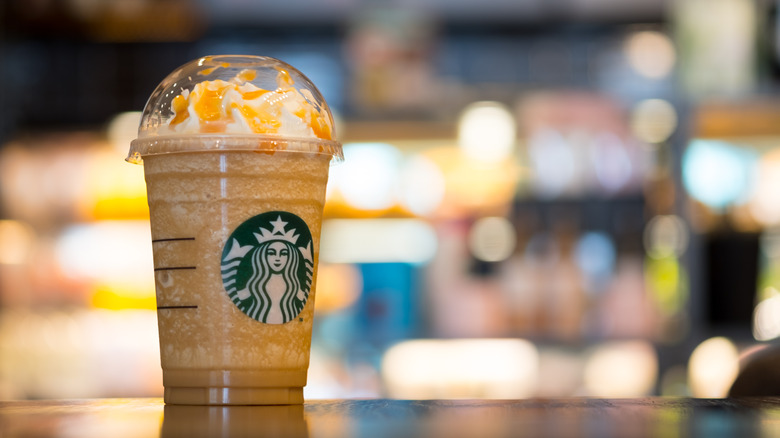 Starbucks caramel frappuccino on table