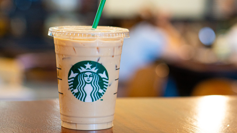 Starbucks iced coffee in focus