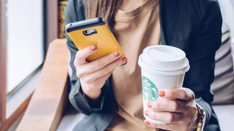 Girl with starbucks in hand 