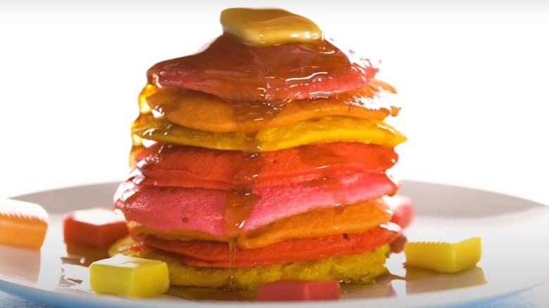 Multicolored Starburst pancakes with butter and syrup