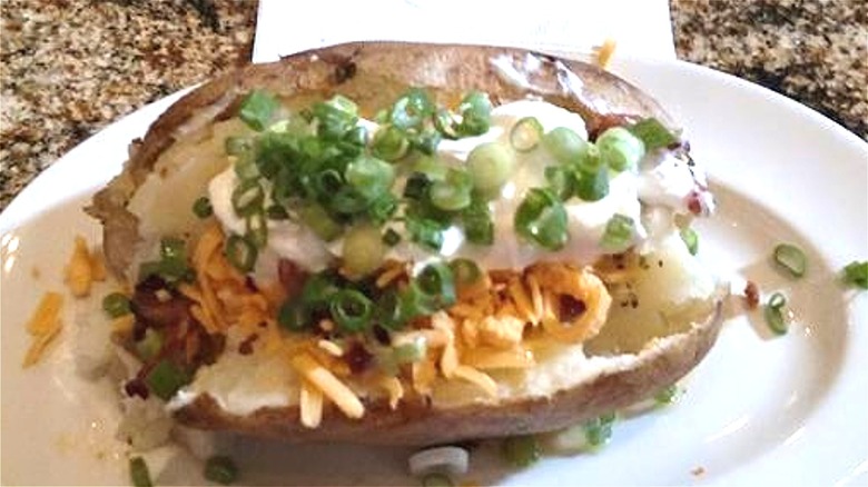 Loaded baked potato on plate