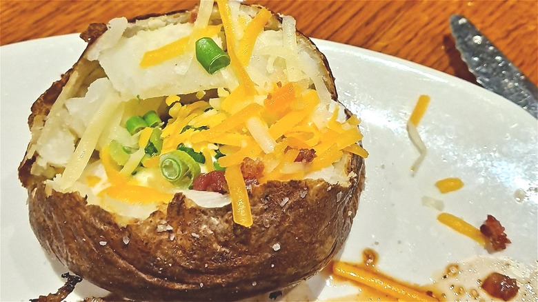 Loaded baked potato on plate