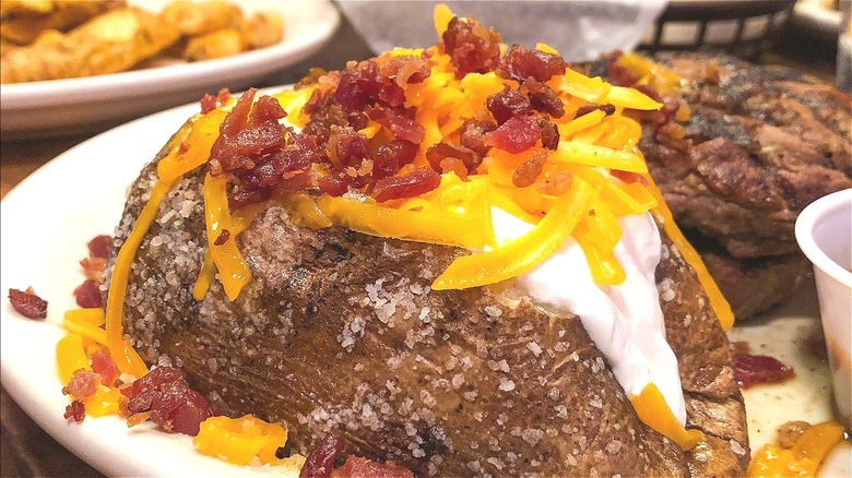 Loaded baked potato on plate