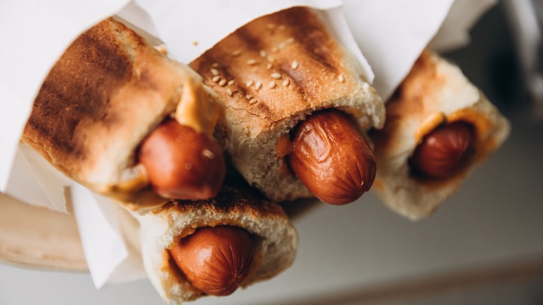 Toasted hot dogs in paper