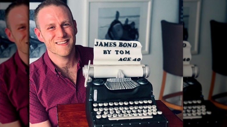 Steven Carter-Bailey with typewriter cake