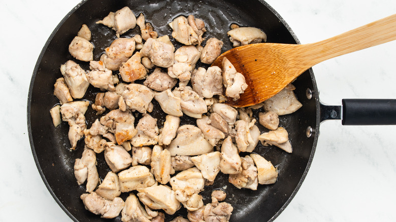 chicken pieces in skillet