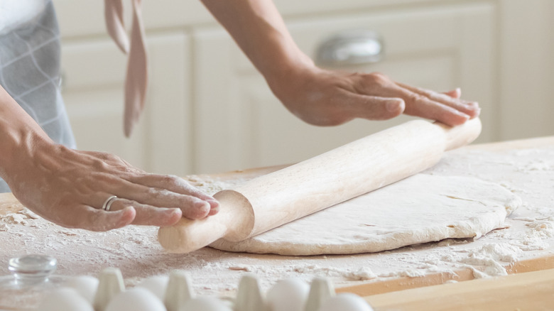 rolling out biscuit dough with rolling pin