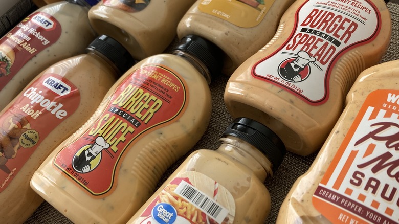 close ups of burger sauce bottles