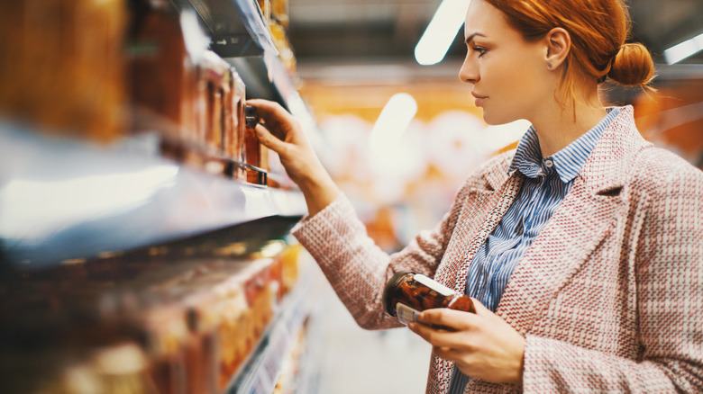 Woman selecting condiments