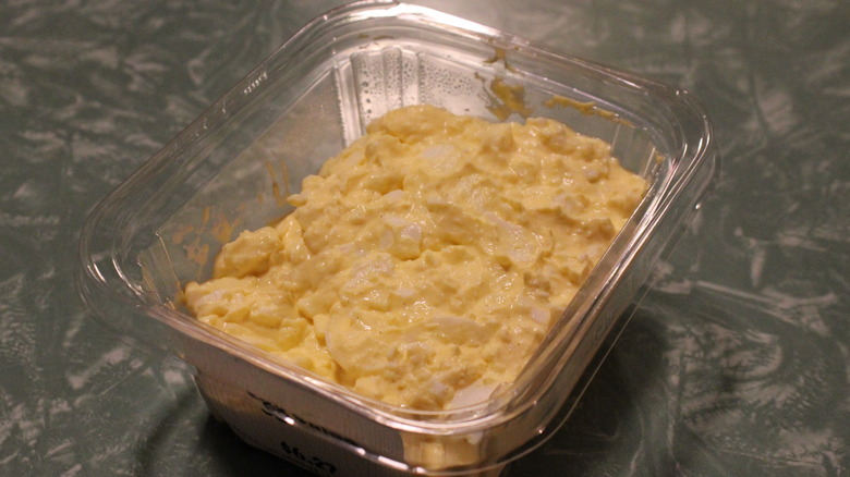 Clear plastic rectangular container with egg salad