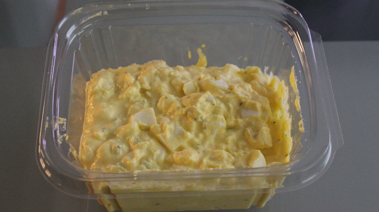 Rectangular clear plastic container of egg salad