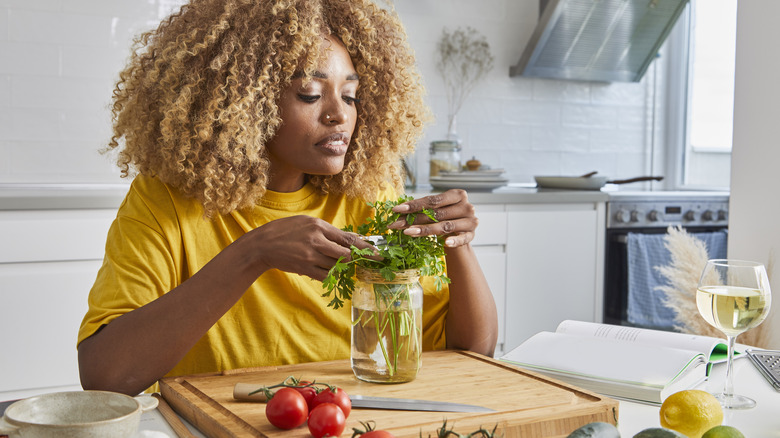 woman preparing herbs