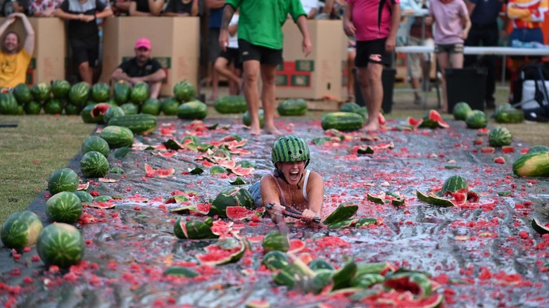 Chinchilla Melon Festival woman on mat with watermelon hat
