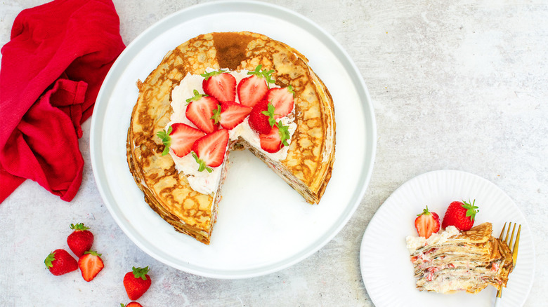 strawberries and cream crepe cake served