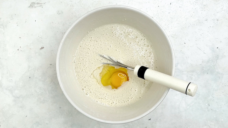 whisking eggs in crepe batter