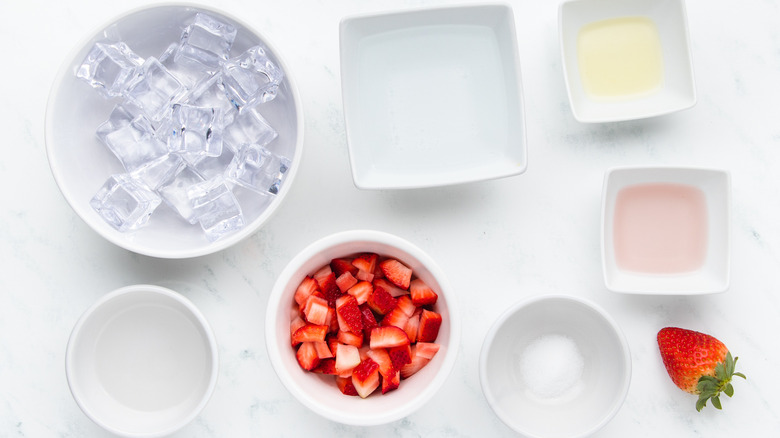 Strawberry and rose cocktail ingredients laid out