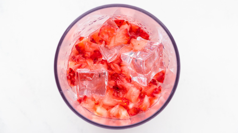 Strawberry cocktail ingredients in shaker