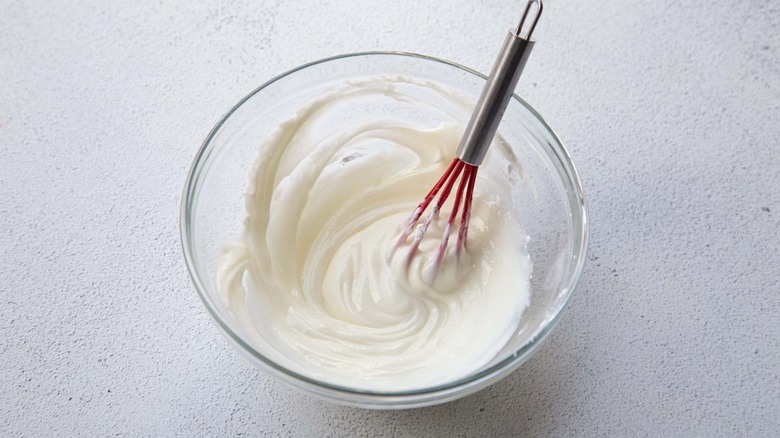 white frosting in bowl