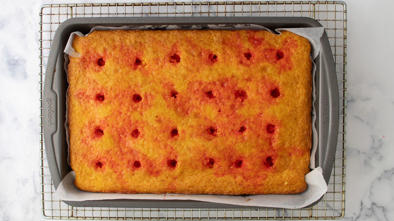 Jell-O poke cake on rack