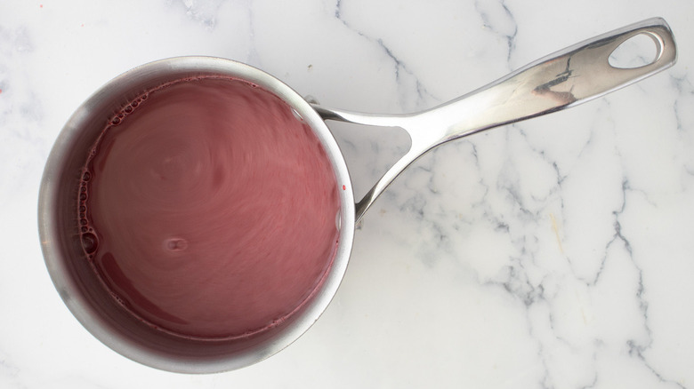 pink liquid in metal pan