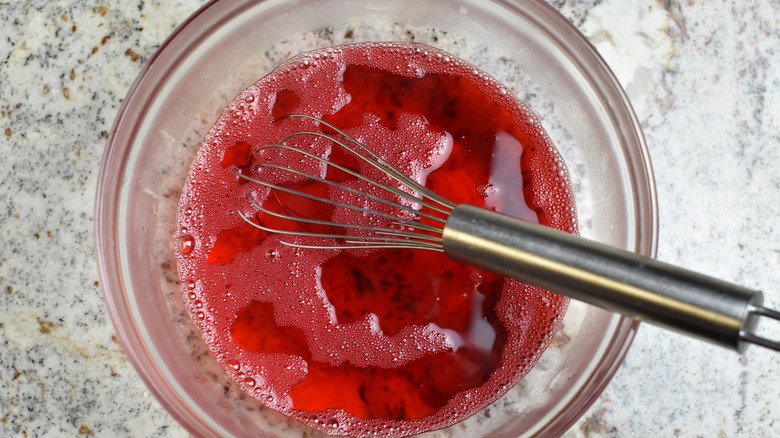 whisking gelatin and water in bowl 