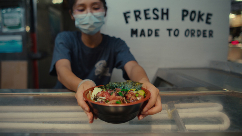 Poke bowl being served