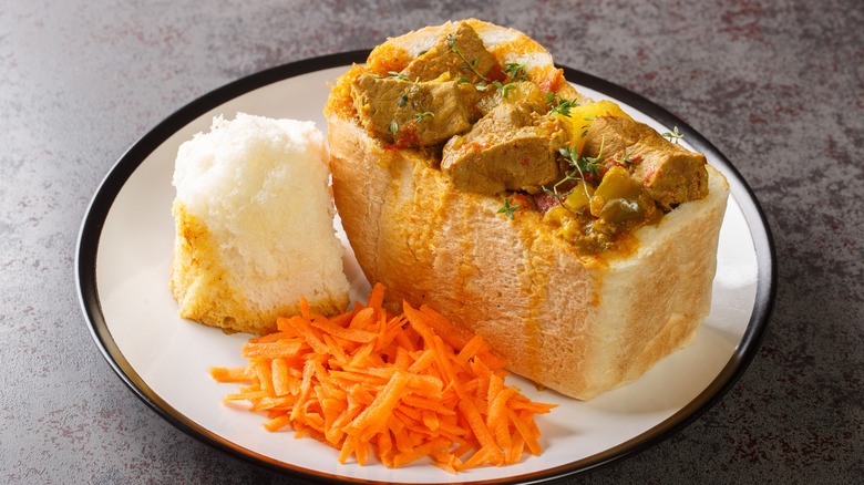 Bunny chow on white plate