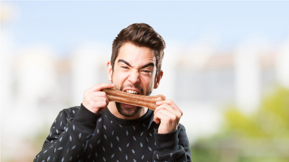 Man chewing bone