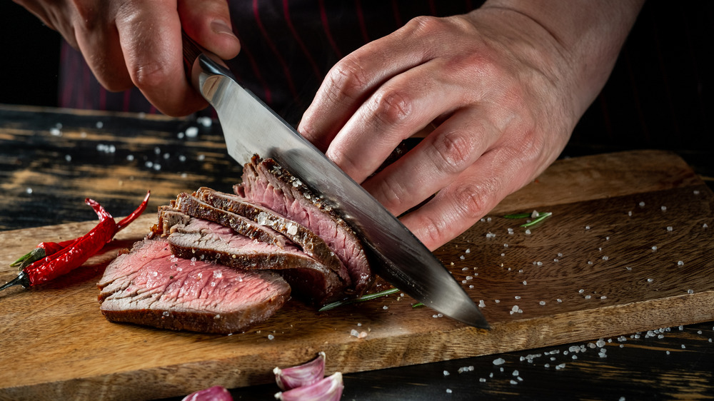 Slicing steak at a steakhouse