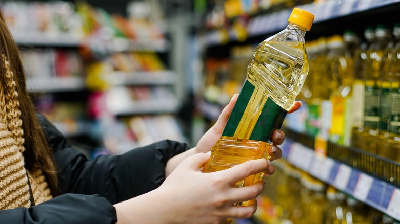 Shopper looking at sunflower oil