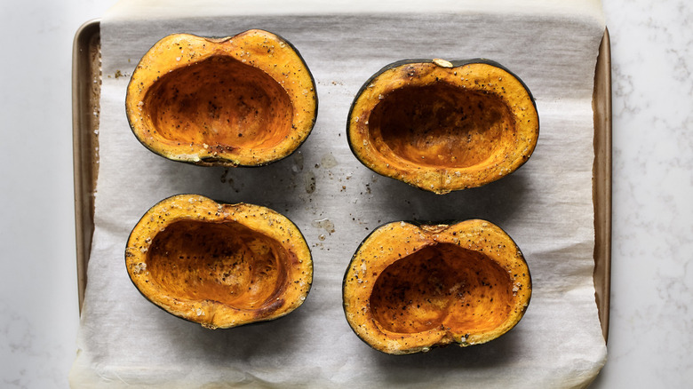 kabocha squash halves on tray