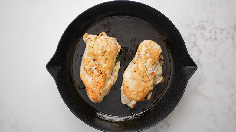 browned turkey tenderloins in pan