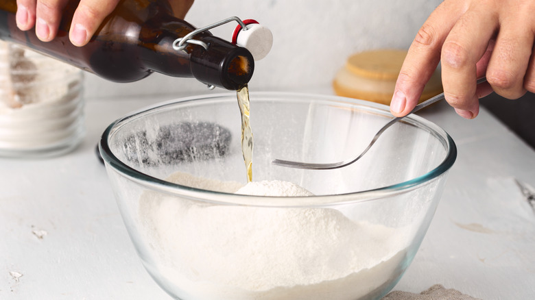 Beer pouring into flour