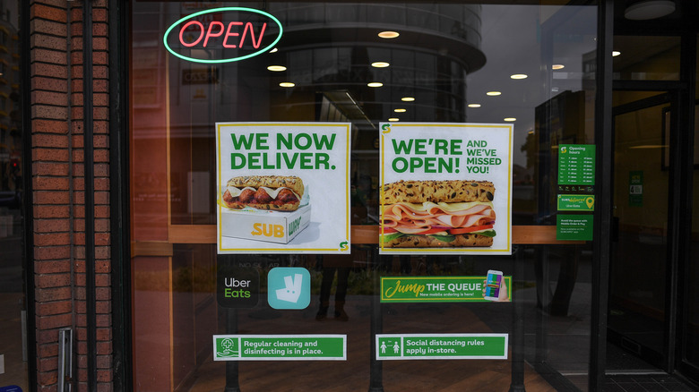 Subway storefront with delivery sign