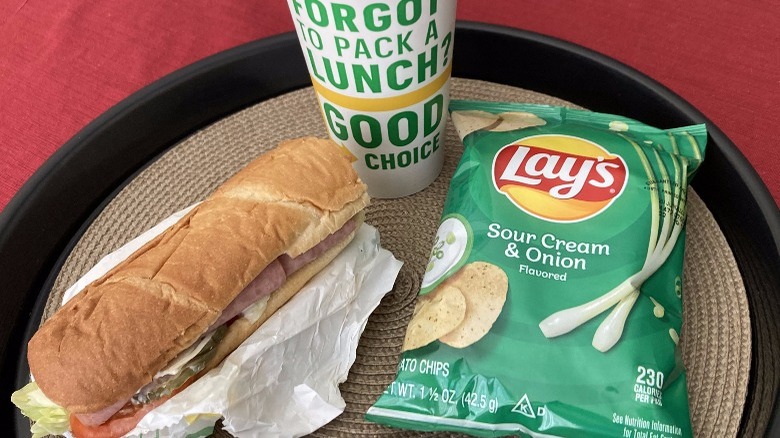 sub sandwich drink and chips