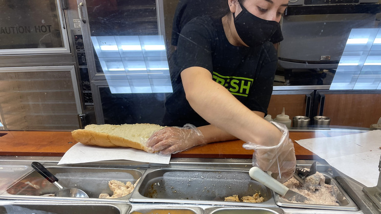 Subway employee makes tuna sandwich