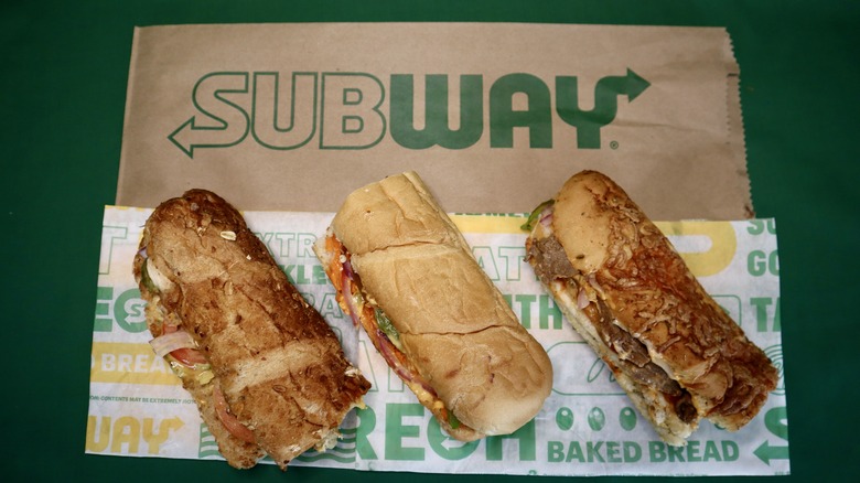 three Subway sandwiches on wrapper