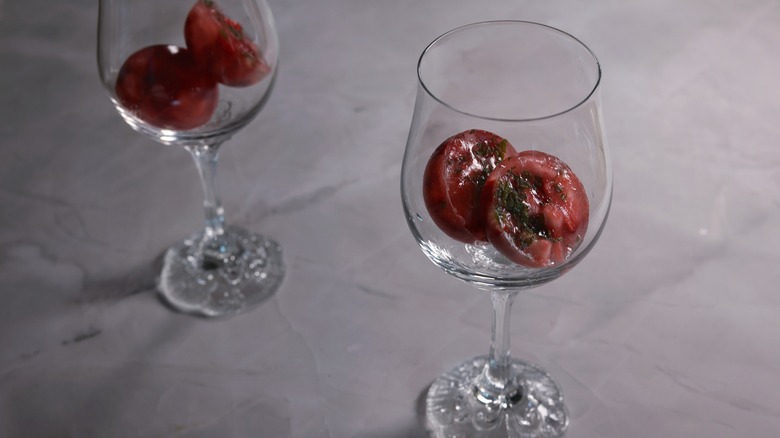 wine glasses with berry ice cubes