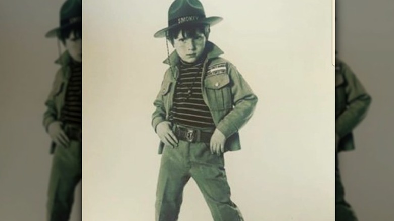 Bobby Flay as a kid in a Smokey the bear costume